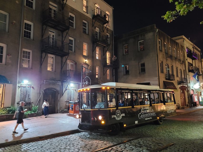 Savannah: Ghosts and Gravestones Tour with Low House Entry - Savannah by night on the Trolley of the Doomed